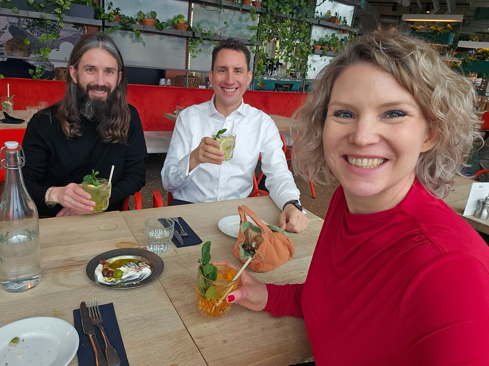 Jonas, Sascha and Linda having a meal together in a restaurant